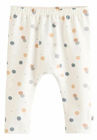 Leggings légers et extensibles en crème avec des pois bleus, orange et noirs dispersés. Dotés d'une taille élastique et de jambes fuselées.