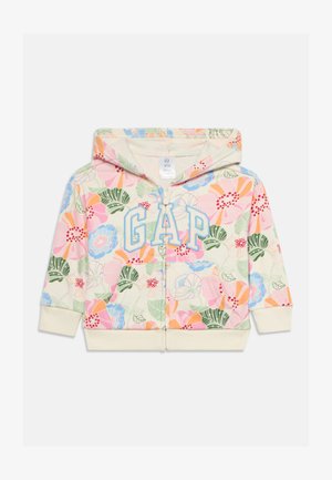 Dječja zip-up majica s kapuljačom s pastelno cvjetnim uzorkom, prednji džep, kremasti rukavi i logo "GAP" u plavim slovima na prsima.