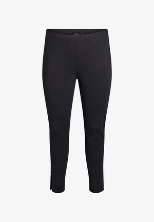 Zwarte leggings met een aansluitend ontwerp, elastische tailleband en decoratieve zijsplit verfraaid met kleine metalen studs. Gladde textuur.