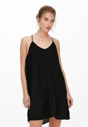 Vestito nero plissettato con spalline sottili, taglio loose fit e scollatura a V. Realizzato in tessuto leggero, che arriva sopra il ginocchio.