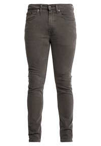 Pantalones vaqueros ajustados en denim gris oscuro, con un diseño clásico de cinco bolsillos, cierre de botón y un leve desvanecimiento en la tela.