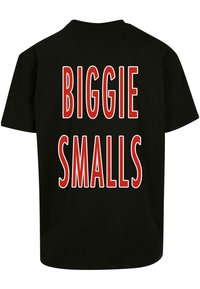 Black cotton t-shirt with short sleeves, featuring bold red text on the back reading "BIGGIE SMALLS" in a prominent block font.