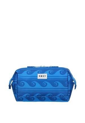 Trousse de toilette rectangulaire bleue avec motifs ondulés, poignées latérales, fermeture éclair et patch logo blanc "ROXY" sur le devant.