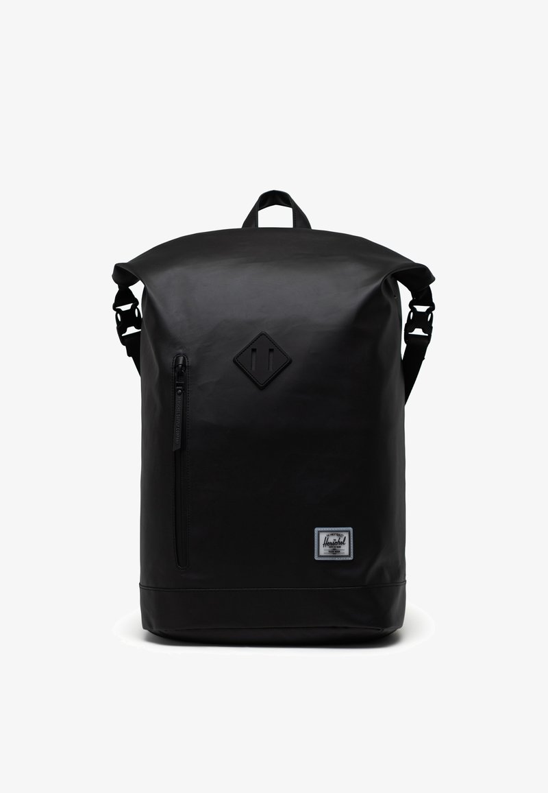 Mustakimmin rullausreppu, joka on valmistettu kestävästä materiaalista. Varustettu etupussilla, säädettävillä hihnoilla ja timantinmuotoisella logolla edessä.