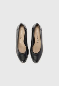 Black leather ballet flats with a slight pointed toe, elasticized edge, and a cushioned insole featuring small perforations. Size 37.