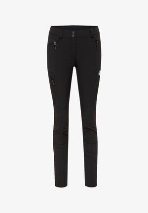 Pantaloni neri elasticizzati con un design aderente, dotati di due tasche laterali con zip e una patch con logo sulla coscia. Tessuto morbido con cuciture.