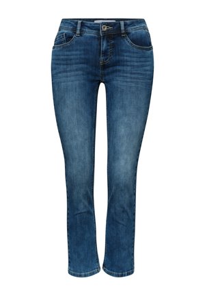 Jean slim en denim bleu avec fermeture frontale à bouton et zip, style cinq poches et légère décoloration aux cuisses et aux genoux.