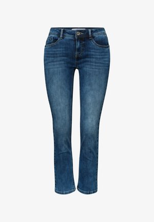 Vaqueros ajustados de mezclilla azul con cierre frontal de botón y cremallera, estilo de cinco bolsillos y ligero desgaste en los muslos y las rodillas.