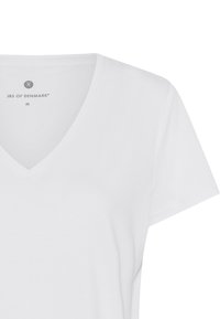 White v-neck t-shirt made of soft cotton, featuring short sleeves and a minimalistic design with a tag that reads "JBS of Denmark" and size "M."