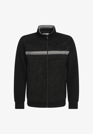 Melnā jaka ar izšūtu dizainu, augstu apkakli, rāvējslēdzēju priekšā, kontrastējošu sudraba svītru un ribota piedurknes un apakšmalu.