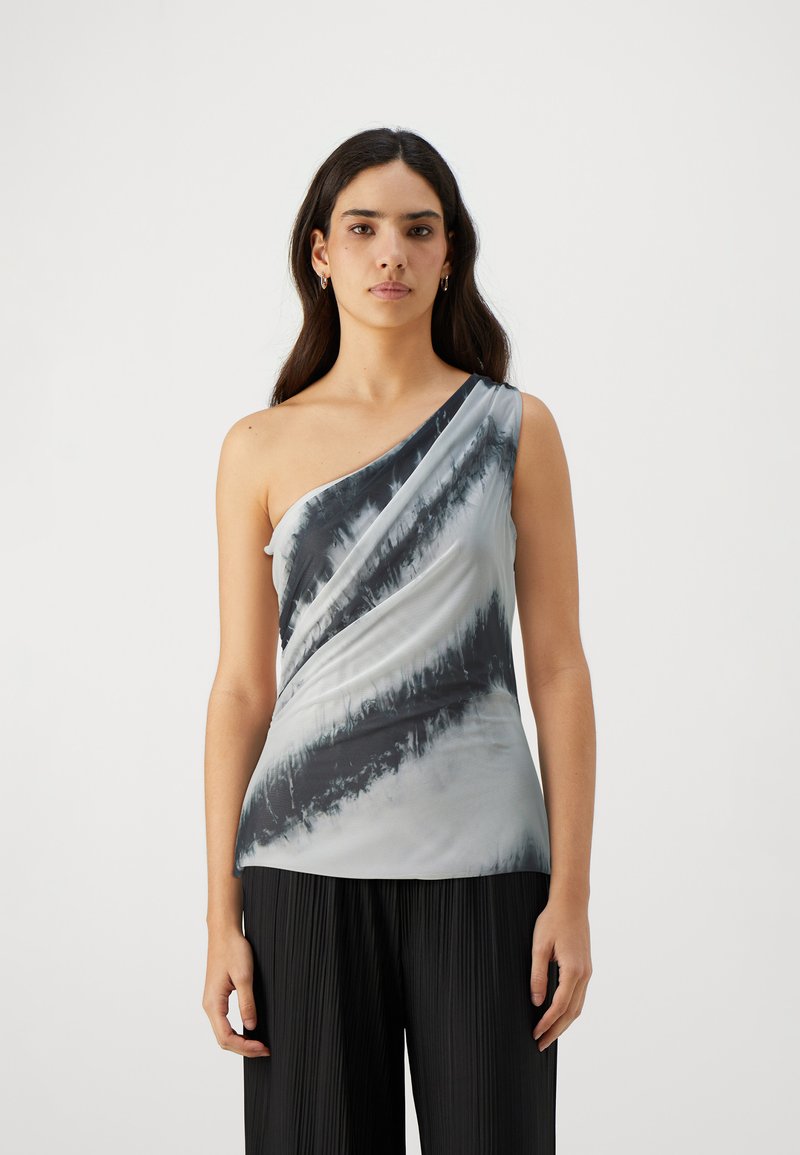One-shoulder top in a light gray fabric with black ombre stripes, featuring draped design and a smooth texture. Styled with pleated black pants.