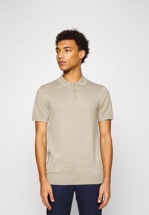 Beige kortærmet polo skjorte med krave, fem-knap lukning og ribbet kant. Fremstillet af et glat, let strikket stof.