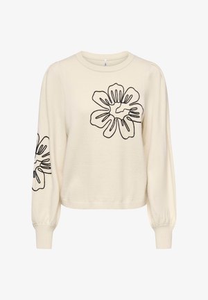 Kreemikas kampsun pika varrukaga, esiküljel ja varrukal musta lillemustriga tikandiga. Pehme tekstuur ja soonikuga äär.