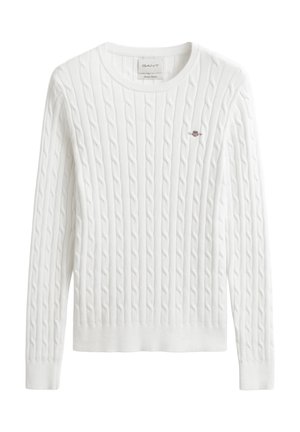 Biely sveter s vidličkovým vzorom, okrúhlym výstrihom, rebrovanými manžetami a lemom, s malým vyšitým logom na ľavej strane hrudníka.