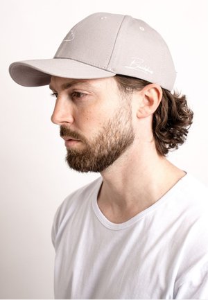 Gray baseball cap with a curved brim and a stitched logo on the front. The cap has a textured fabric finish.