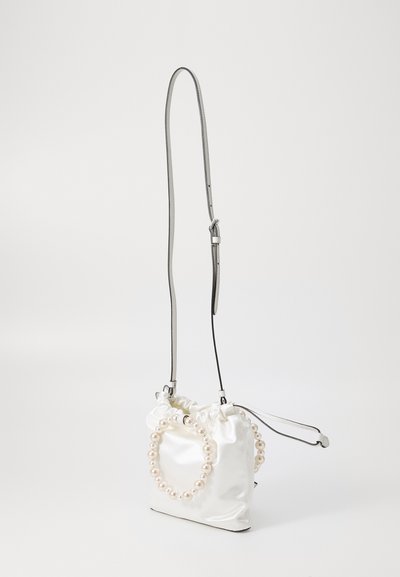 White satin handbag with a gathered design, featuring a pearl accent strap and adjustable metallic shoulder strap. Smooth texture.