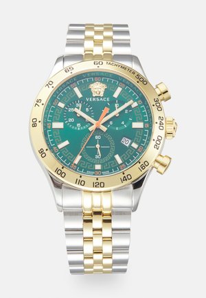 Versace watch with a green dial, gold and silver stainless steel case, chronograph features, Greek key pattern, and a tachymeter bezel.