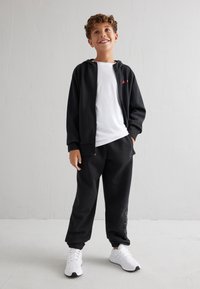 adidas Performance STAR WARS ADIDAS Z.N.E. FULL-ZIP - Majica s kapuljačom i patentnim zatvaračem - black/bright red