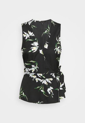 Haut cache-cœur noir à motif floral blanc et vert, sans manches, col en V profond, avec lien sur le côté pour un ajustement personnalisé.