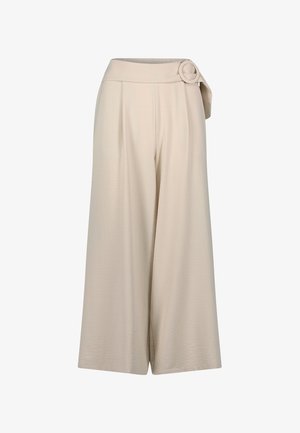 Light beige wide-leg trousers with a high waistband and a circular belt buckle detail. Smooth, textured fabric with front pleats.