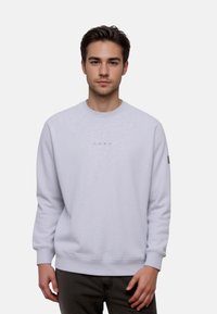 Light gray crewneck sweatshirt made of soft fabric, featuring ribbed cuffs and hem, and a subtle "CORE" logo on the chest.