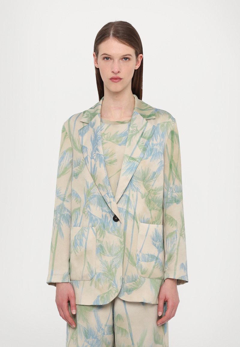 Lightweight blazer in cream with a palm leaf pattern in green and blue. Features a notch lapel, two front pockets, and a single button closure.