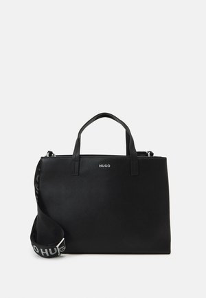 Musta suorakaiteen muotoinen käsilaukku, jossa yläkahvat, irrotettava olkahihna, jossa teksti "HUGO", ja pieni "HUGO"-logo etukeskellä.