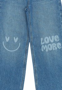 The New PURITY WIDE - Trapezaste traperice - medium blue denim