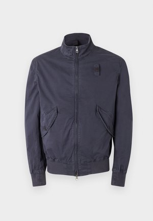 Navy blue lightweight jacket with front zipper, two angled flap pockets, high collar, and adjustable cuff tabs.