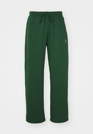 Pantaloni della tuta verdi realizzati in materiale morbido, con cintura elastica, chiusura con cordino e un piccolo logo sulla coscia sinistra.