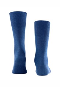 Sötétkék pamutzoknik bordázott boka pántokkal és sima textúrával. Varrás nélküli lábujj kialakítás növeli a kényelmet és a tökéletes illeszkedést.