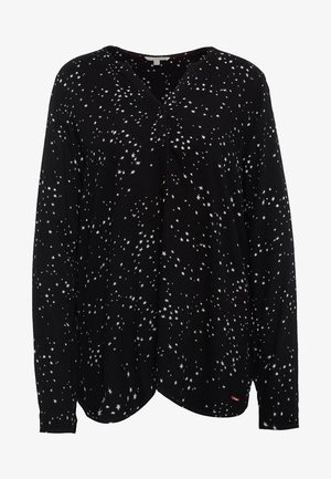 Langärmlige schwarze Bluse mit weißem Sternmuster, V-Ausschnitt und Knopfdetail, gefertigt aus weichem Stoff mit lockerem Schnitt.