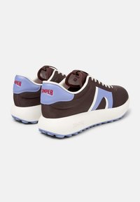 Brown textile sneakers with light blue accents and a white midsole. Features a prominent Camper logo and textured pattern on the upper.