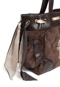 Brown suede and leather handbag with gold-tone hardware, featuring cream and dark brown silk ribbons tied at the handles for decoration.