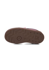 Brown rubber outsole with a textured pattern, featuring circular and wavy designs; part of a footwear product.