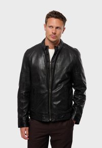 Black leather jacket with a smooth texture, zip front, and stand collar. Features side pockets and detailed stitching along the hem.