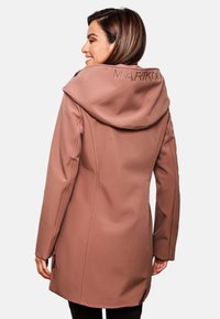 Brown, fitted jacket with a large hood, side pockets, and tonal stitching. Features "MARIKOO" embroidered on the back. Smooth texture.