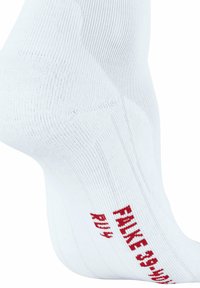 Calzino sportivo bianco realizzato in tessuto testurizzato, con il logo rosso "FALKE 39" stampato di lato. Include un design a coste per una vestibilità ottimale.