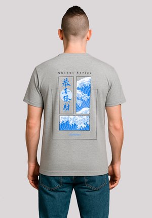 Gray cotton t-shirt featuring blue wave artwork on the back, with the text "Shibui Series" above and “Fantastic” below. Casual fit.