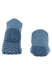 Chaussettes bleu clair avec grip en caoutchouc texturé sous la semelle, dotées d'un design en maille lisse et de sections talon et pointe renforcées.