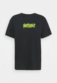 Black cotton t-shirt featuring a neon green graphic text "NIGHTLIFE" at the chest. Crew neckline and short sleeves.