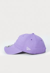 Purple cotton cap with a curved brim, featuring white logo embroidery and ventilation eyelets on sides. Smooth texture, casual design.