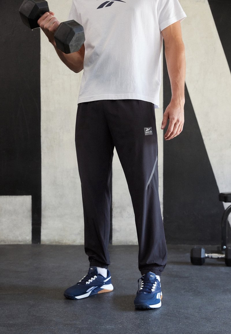 Reebok Teplákové kalhoty - black