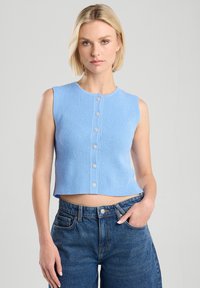 Light blue, sleeveless cropped knit top featuring a ribbed texture and six button closures down the front. Simple and fitted design.