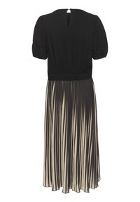 Juoda palaidinė su pūstomis rankovėmis ir raktų skylute nugaroje, pereinanti į kreminę sijoną su vertikaliomis juodomis juostelėmis; elastingas liemuo ir plazdanti medžiaga.