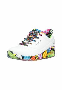 White Skechers sneaker with colorful patterned sole, multicolored laces, and vibrant inner lining, showing brand name on side and tongue.