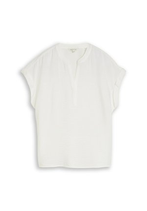 Blouse blanche à manches courtes avec un col en V fendu et une coupe décontractée, en tissu léger.