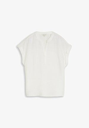 Blouse blanche à manches courtes avec un col en V fendu et une coupe décontractée, en tissu léger.