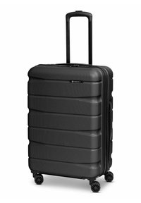 Valise rigide noire texturée avec quatre roues pivotantes et une poignée télescopique étendue.
