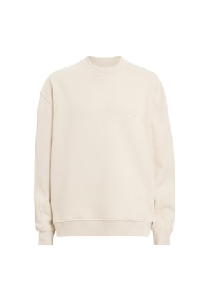 Crewneck sweatshirt i lys beige, lavet af blødt stof. Har ribbede manchetter og hals, med diskret broderi på brystet.